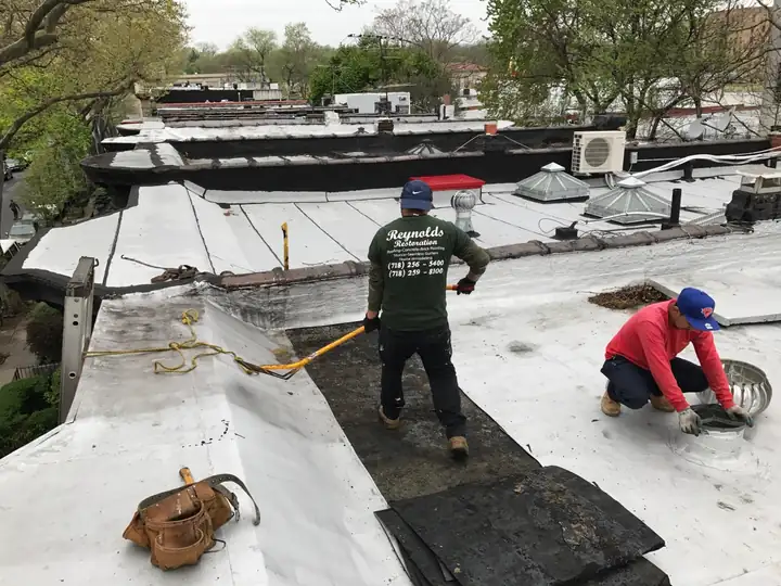 Reynolds crew installing a new flat roof on a Brooklyn building