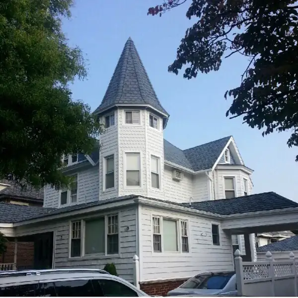 Turreted Victorian home with new roofing