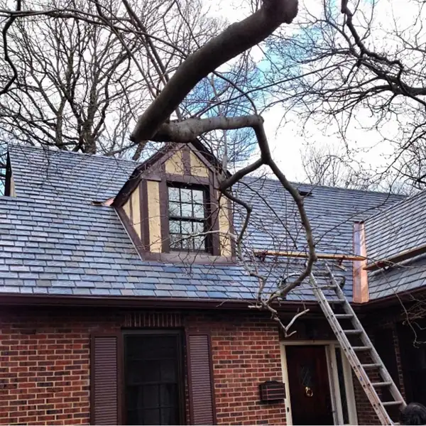 Tudor-style brick house with a new slate-look roof
