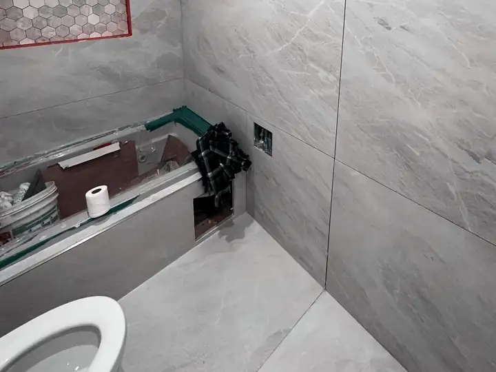 Newly tiled bathroom during a renovation