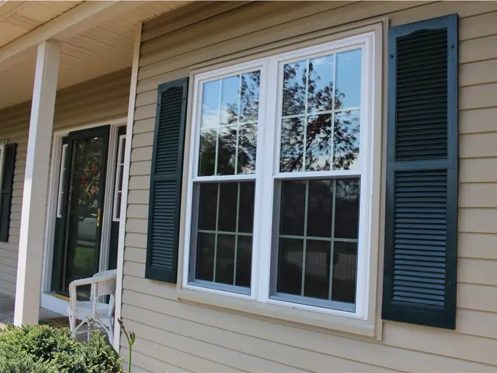 New white double-hung replacement windows on a house